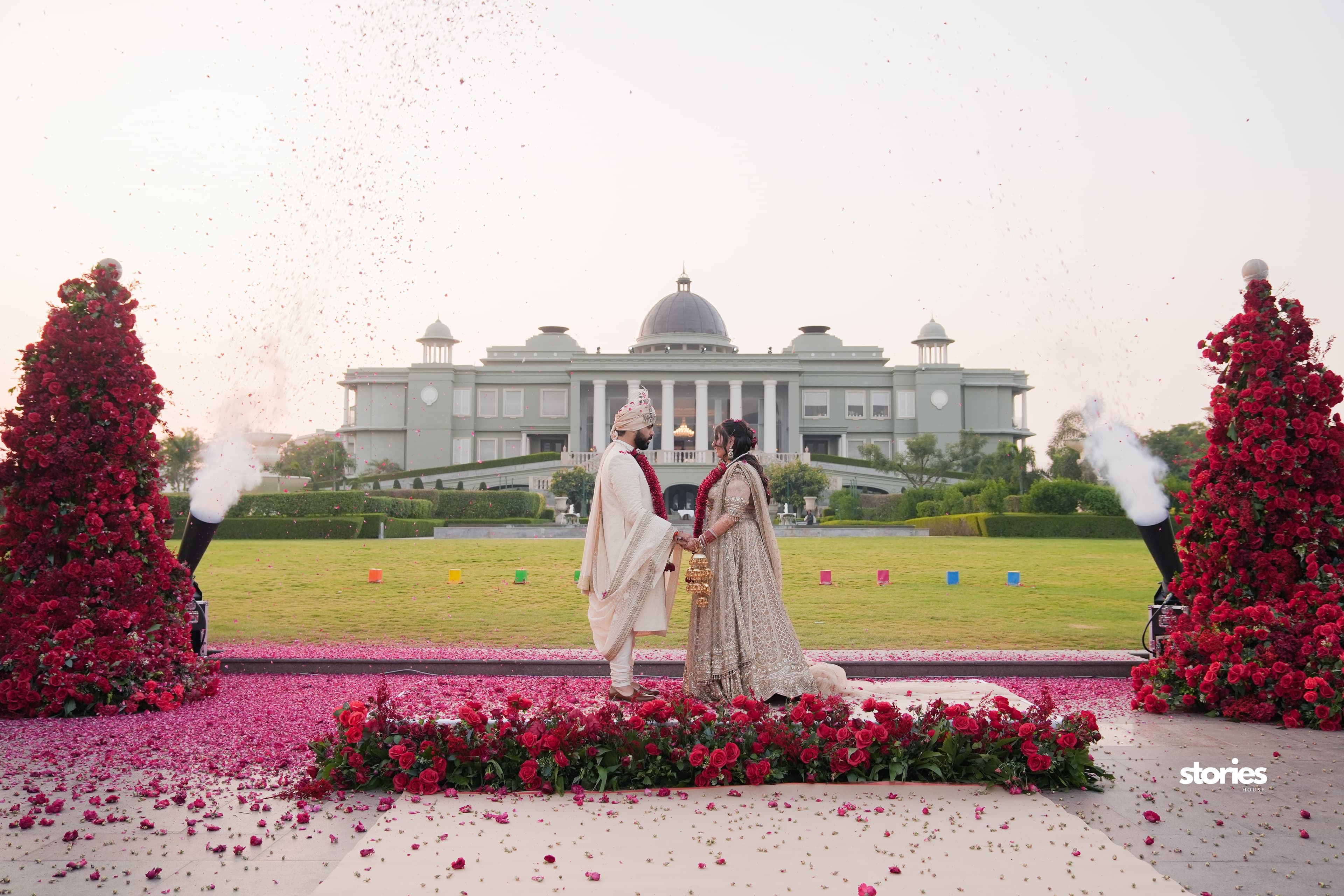 A couple celebrating their wedding surrounded by roses